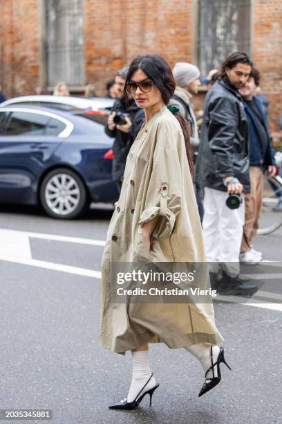 Angela Rozas Saiz wears trench coat during outside the Milan Fashion Week - Womenswear Fall/Winter 2024-2025 on February 23, 2024 in Milan, Italy.