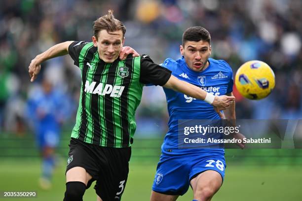 Marcus Holmgren Pedersen of US Sassuolo is challenged by Nicolo Cambiaghi of Empoli FC during the Serie A TIM match between US Sassuolo and Empoli FC...