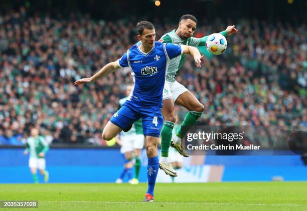 Christoph Zimmermann of SV Darmstadt 98 battles for possession with Felix Agu of SV Werder Bremen during the Bundesliga match between SV Werder...