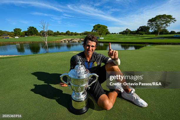 Altin Van Der Merwe of South Africa poses with the trophy following his victory in a playoff during day four of the Africa Amateur Championship and...