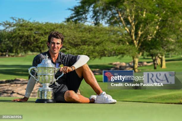 Altin Van Der Merwe of South Africa poses with the trophy following his victory in a playoff during day four of the Africa Amateur Championship and...