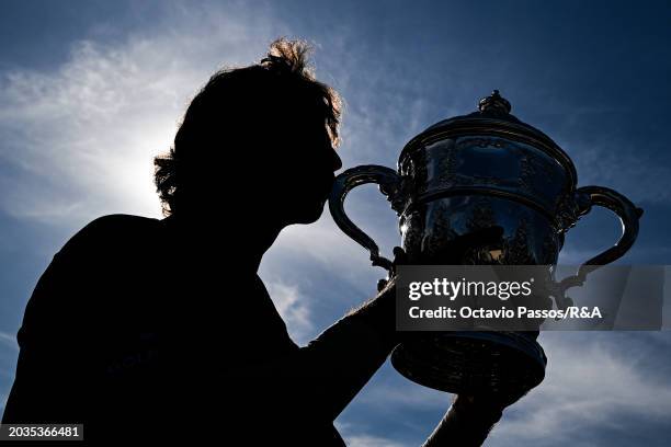 Altin Van Der Merwe of South Africa poses with the trophy following his victory in a playoff during day four of the Africa Amateur Championship and...