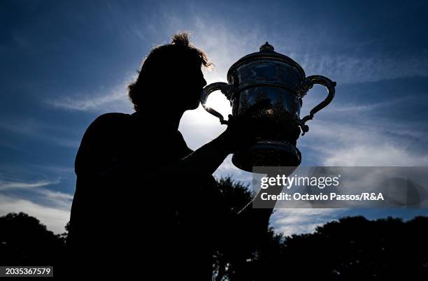 Altin Van Der Merwe of South Africa poses with the trophy following his victory in a playoff during day four of the Africa Amateur Championship and...