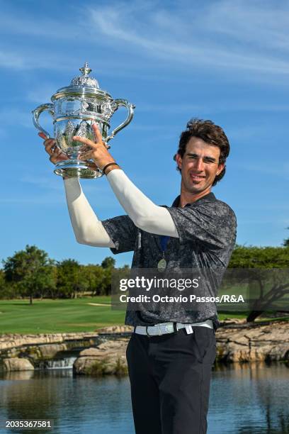 Altin Van Der Merwe of South Africa poses with the trophy following his victory in a playoff during day four of the Africa Amateur Championship and...