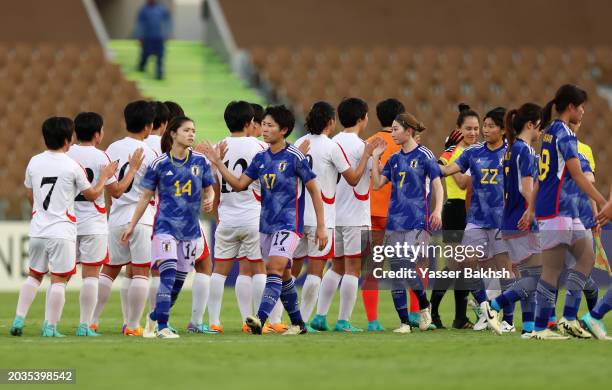 Players of Japan shake hands with the Match Officials and players of North Korea following the AFC Women's Olympic Football Tournament Paris 2024...