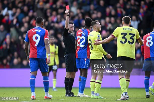 Referee, Lewis Smith shows a red card to Josh Brownhill of Burnley during the Premier League match between Crystal Palace and Burnley FC at Selhurst...