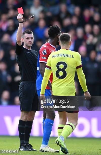 Referee, Lewis Smith shows a red card to Josh Brownhill of Burnley during the Premier League match between Crystal Palace and Burnley FC at Selhurst...