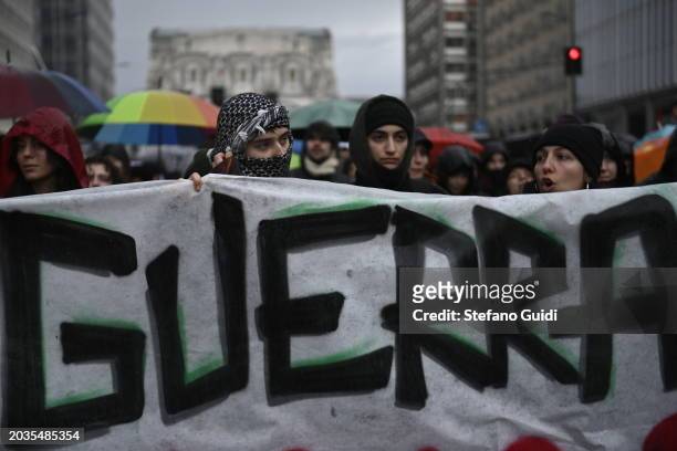 People holds a protest banner with written "War" during the Pro-Palestine Demonstration on February 24, 2024 in Milan, Italy. The war between Israel...