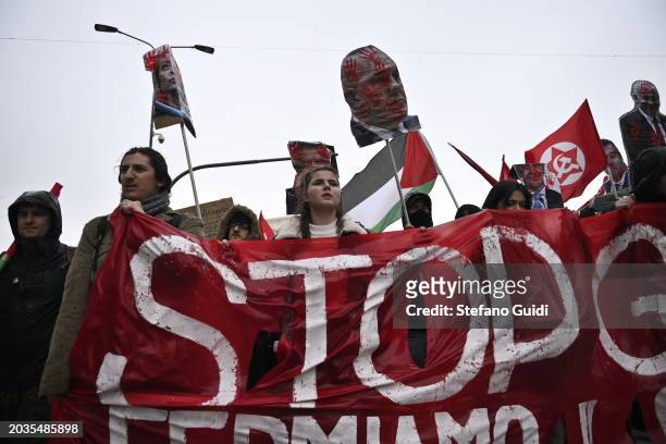 People hold a protest banner with written "Stop" during the Pro-Palestine Demonstration on February 24, 2024 in Milan, Italy. The war between Israel...
