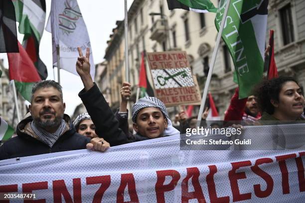 Children show peace symbol with hand during the Pro-Palestine Demonstration on February 24, 2024 in Milan, Italy. The war between Israel and Hamas,...