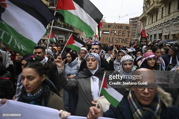 General view of People hold a protest sign and Palestine flag during the Pro-Palestine Demonstration on February 24, 2024 in Milan, Italy. The war...