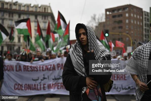 Woman dress Palestine kefiah during the Pro-Palestine Demonstration on February 24, 2024 in Milan, Italy. The war between Israel and Hamas, now in...