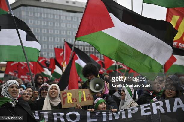 General view of People hold a protest sign and Palestine flag during the Pro-Palestine Demonstration on February 24, 2024 in Milan, Italy. The war...