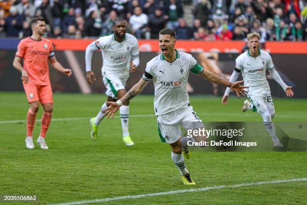 Julian Weigl of Borussia Moenchengladbach celebrates after scoring his team's second goal during the Bundesliga match between Borussia...