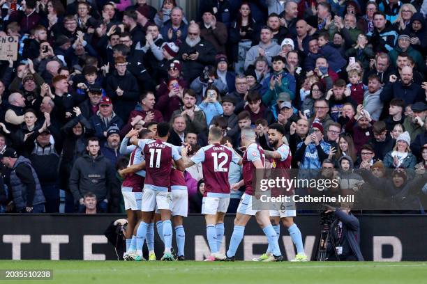Leon Bailey of Aston Villa celebrates scoring his team's fourth goal with teammates during the Premier League match between Aston Villa and...