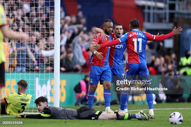 Jordan Ayew of Crystal Palace celebrates scoring his team's second goal with teammates during the Premier League match between Crystal Palace and...