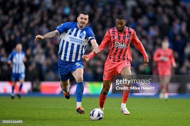 Lewis Dunk of Brighton & Hove Albion and Beto of Everton battle for possession during the Premier League match between Brighton & Hove Albion and...