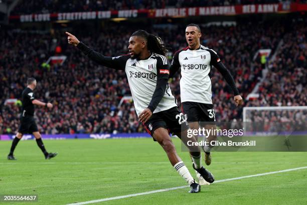 Alex Iwobi of Fulham celebrates scoring his team's second goal during the Premier League match between Manchester United and Fulham FC at Old...