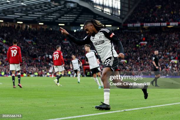 Alex Iwobi of Fulham celebrates scoring his team's second goal during the Premier League match between Manchester United and Fulham FC at Old...