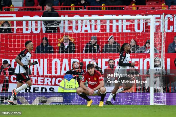 Harry Maguire of Manchester United looks dejected after Alex Iwobi of Fulham scores his team's second goal during the Premier League match between...