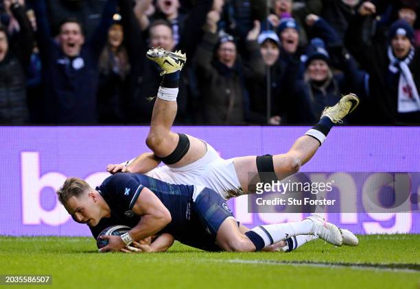 Duhan van der Merwe of Scotland scores his team's first try whilst under pressure from Ben Earl of England during the Guinness Six Nations 2024 match...