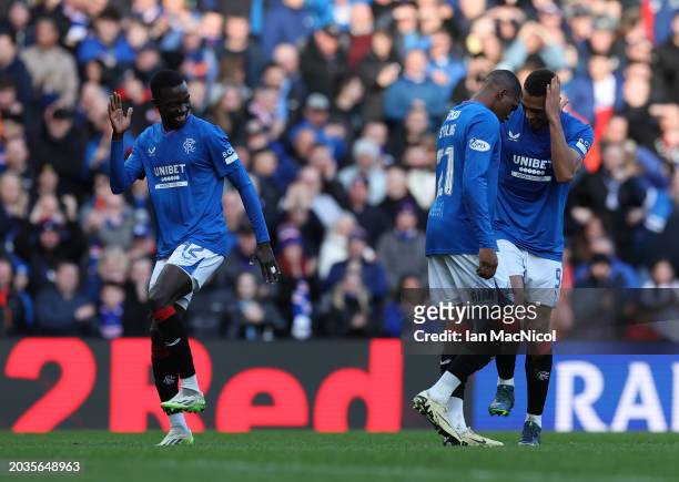 Mohamed Diomande of Rangers celebrates with Cyriel Dessers after he scores his team's third goal during the Cinch Scottish Premiership match between...