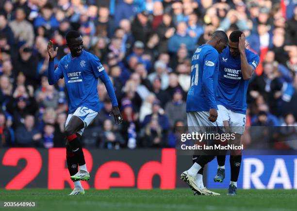 Mohamed Diomande of Rangers celebrates with Cyriel Dessers after he scores his team's third goal during the Cinch Scottish Premiership match between...