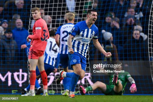 Lewis Dunk of Brighton celebrates after equalising during the Premier League match between Brighton & Hove Albion and Everton FC at American Express...