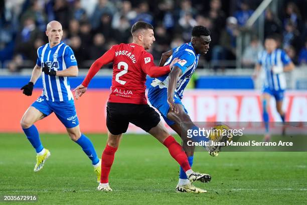 Matija Nastasic of RCD Mallorca battles for possession with Samu Omorodion of Deportivo Alaves during the LaLiga EA Sports match between Deportivo...