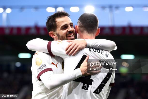 Phil Foden of Manchester City celebrates scoring his team's first goal with teammate Bernardo Silva during the Premier League match between AFC...