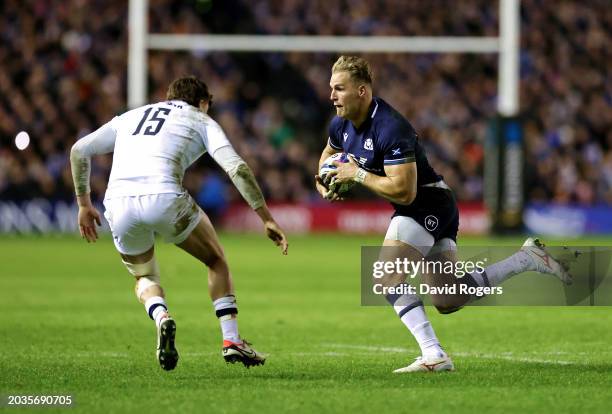 Duhan van der Merwe of Scotland runs with the ball whilst under pressure from George Furbank of England during the Guinness Six Nations 2024 match...