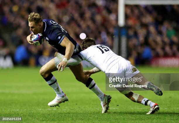 Duhan van der Merwe of Scotland runs with the ball whilst under pressure from George Furbank of England during the Guinness Six Nations 2024 match...