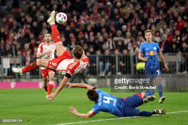 Harry Kane of Bayern Munich performs a bicycle kick whilst under pressure from Willi Orban of RB Leipzig during the Bundesliga match between FC...