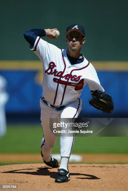 Greg Maddux of the Atlanta Braves throws a pitch during the game against the Montreal Expos on Opening Day at Turner Field on March 31, 2003 in...