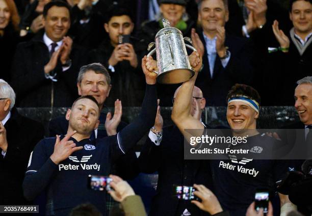 Finn Russell and Rory Darge of Scotland lift the Calcutta Cup after defeating England during the Guinness Six Nations 2024 match between Scotland and...