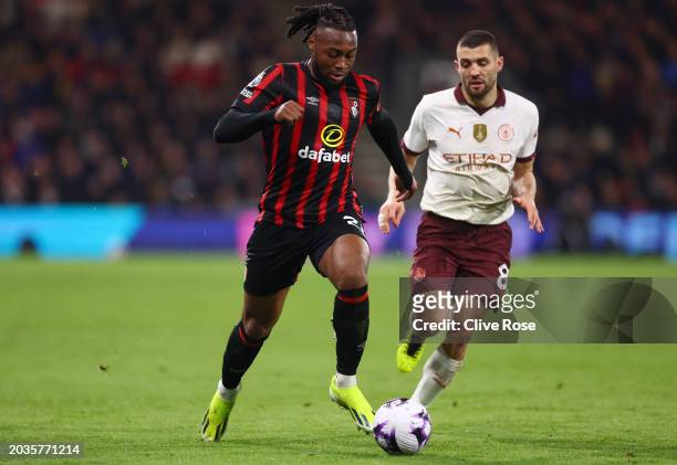 Antoine Semenyo of AFC Bournemouth runs with the ball whilst under pressure from Mateo Kovacic of Manchester City during the Premier League match...