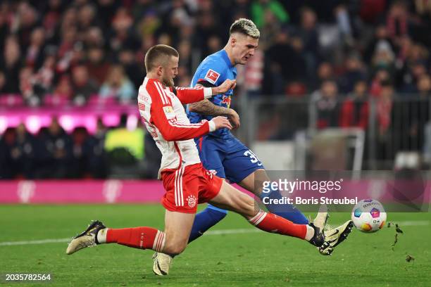 Benjamin Sesko of RB Leipzig is challenged by Eric Dier of Bayern Munich during the Bundesliga match between FC Bayern München and RB Leipzig at the...