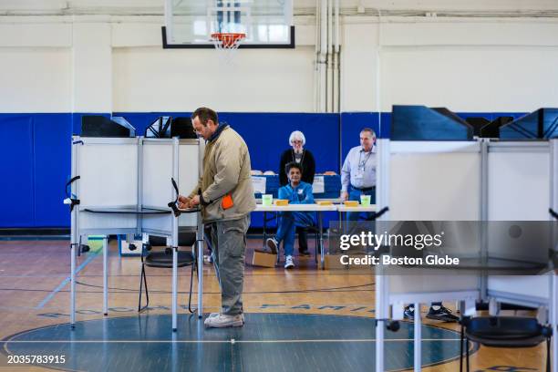 Boston, MA Early voters fill out their ballots at BCYF Roche Community Center in West Roxbury in the days leading up to the upcoming Presidential...