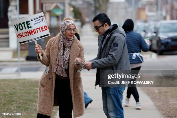 Aruba Obeid asks people to vote uncommitted, instead of for US President Joe Biden, outside of Maples Elementary School in Dearborn during the...