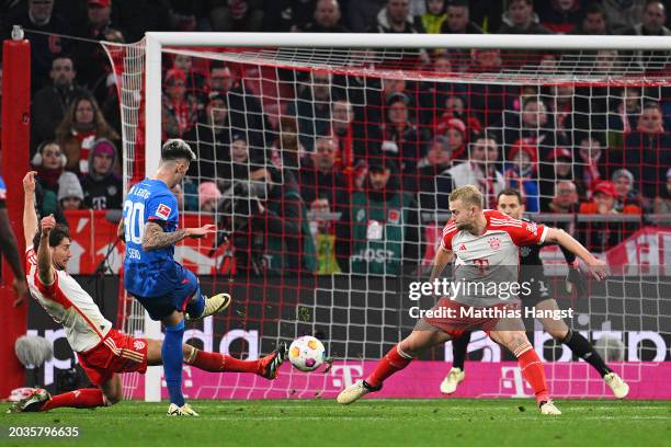 Benjamin Sesko of RB Leipzig scores his team's first goal during the Bundesliga match between FC Bayern München and RB Leipzig at the Allianz Arena...