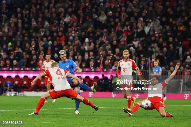 Benjamin Sesko of RB Leipzig scores his team's first goal during the Bundesliga match between FC Bayern München and RB Leipzig at the Allianz Arena...