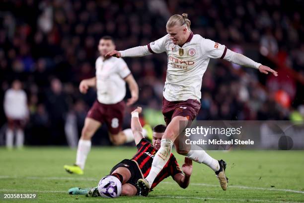Erling Haaland of Manchester City is challenged by Milos Kerkez of AFC Bournemouth during the Premier League match between AFC Bournemouth and...