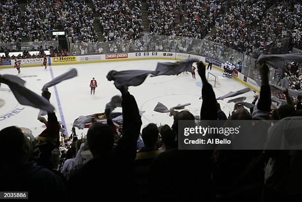 Fans of the Ottawa Senators cheer Magnus Arvedson's goal against Martin Brodeur of the New Jersey Devils in the 1st period during game 7 of the NHL...