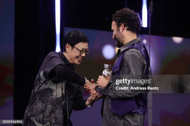 International Jury member 2024 Ann Hui presents the Silver Bear for Best Director for “Pepe” to Nelson Carlos De Los Santos Arias on stage at the...