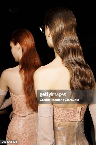 Models, hair detail, are seen backstage ahead of the Ermanno Scervino fashion show during the Milan Fashion Week Womenswear Fall/Winter 2024-2025 on...