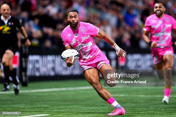 Peniasi Dakuwaqa of Stade Francais runs with the ball during the Top 14 match between Racing 92 and Stade Francais at Paris La Defense Arena on...