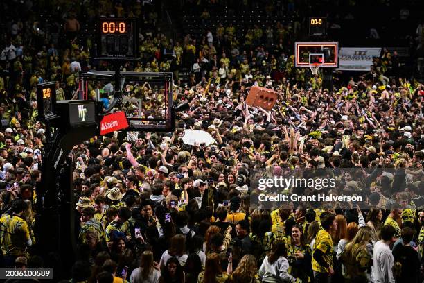 Wake Forest Demon Deacons fans storm the court after a win Duke Blue Devils at Lawrence Joel Veterans Memorial Coliseum on February 24, 2024 in...