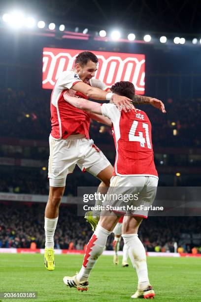 Jakub Kiwior of Arsenal celebrates scoring his team's fourth goal with teammate Declan Rice during the Premier League match between Arsenal FC and...