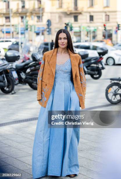 Paola Turani wears blue dress, brown blazer outside Ermanno Scervino during the Milan Fashion Week - Womenswear Fall/Winter 2024-2025 on February 24,...