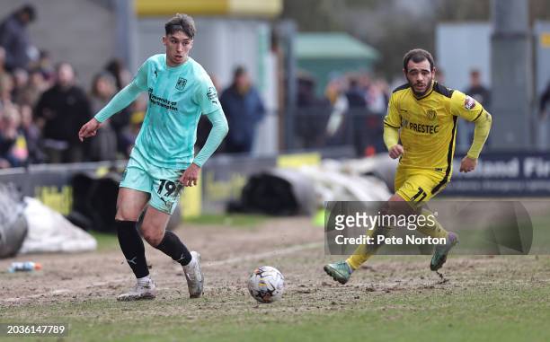 Kieron Bowie of Northampton Town plays the ball away from Mason Bennett of Burton Albion during the Sky Bet League One match between Burton Albion...